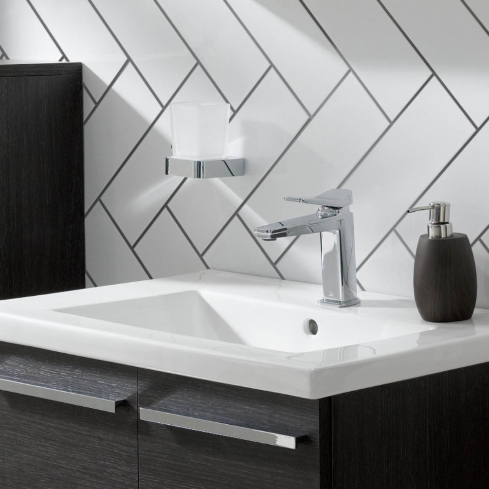 Close up product lifestyle image of the JTP Hix Chrome Tumbler Holder mounted above a vanity unit